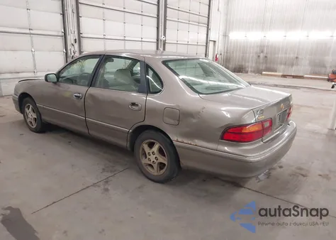 1999 Toyota Avalon Xls z USA, uszkodzony, nr VIN 4T1BF18B8XU302143